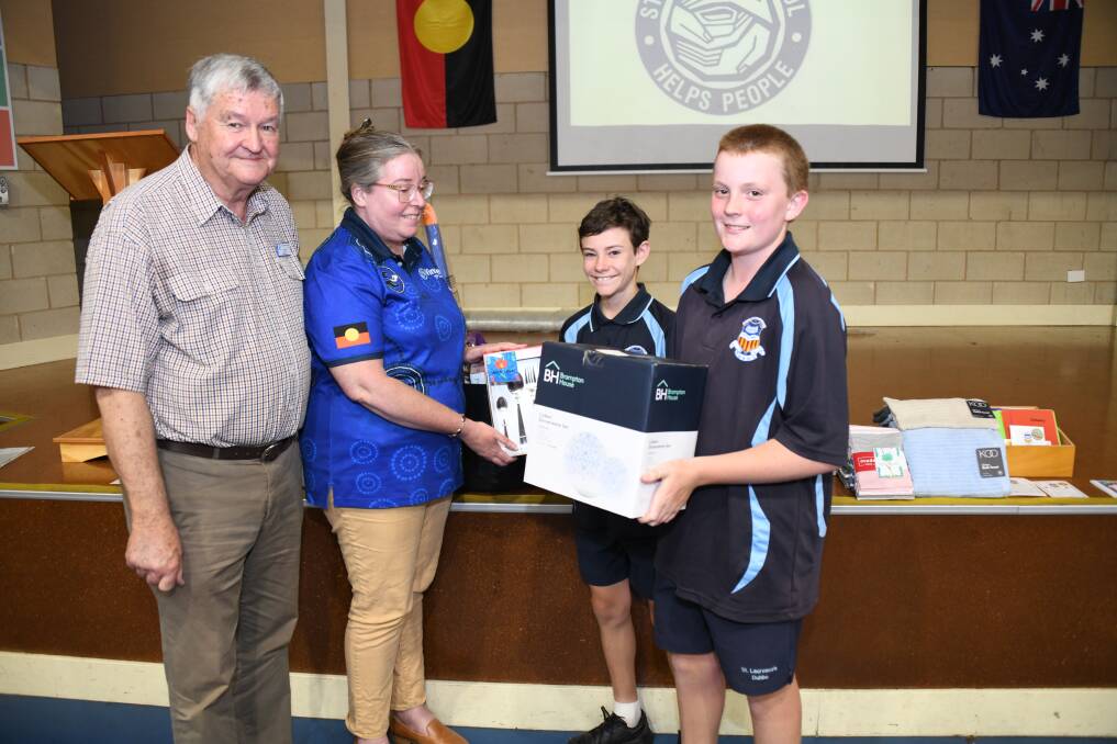 Ian Wray and Kim Colbourne from Vinnies, with Aidan Doherty and Xavier Brown of St Laurence's Catholic Primary School. Picture by Amy McIntyre