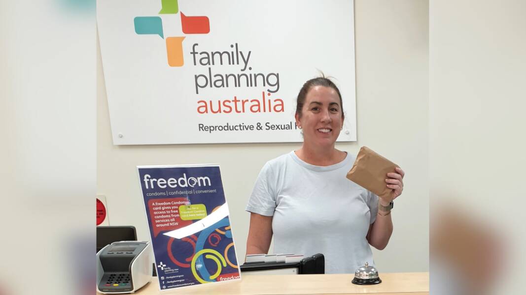 A staff member from Family Planning Australia's Dubbo office with one of the discrete condom and lube packs. Picture supplied