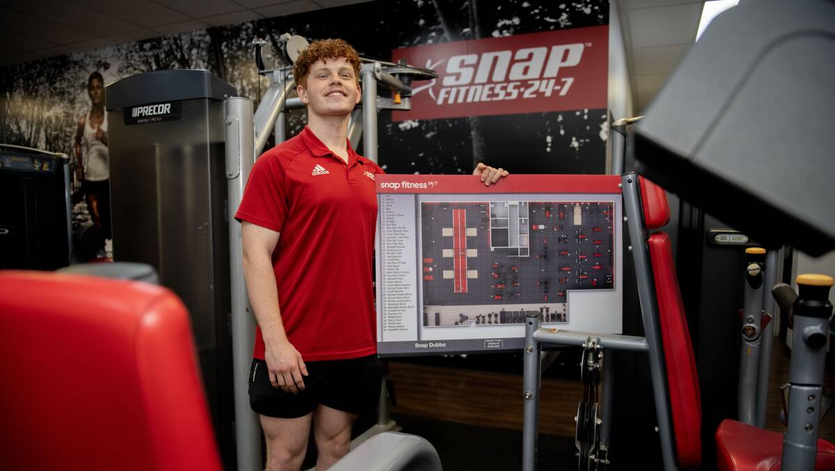 Snap Fitness Dubbo club manager Zac Watson with plans for the upgraded gym. Picture by Belinda Soole