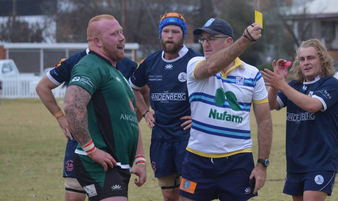 OFF YOU GO: Referee Pete Thomas sends Cody Perrott to the sin bin on Saturday, much to the delight of Forbes' Jock Grant (right). Photo: MATT FINDLAY