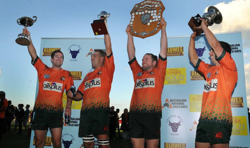 LIONS ROAR: Orange City's Sam Coote, Chris Barrett, Josh Tremain and Michael Sparks celebrate their second consecutive, undefeated title in 2013. Photo: STEVE GOSCH