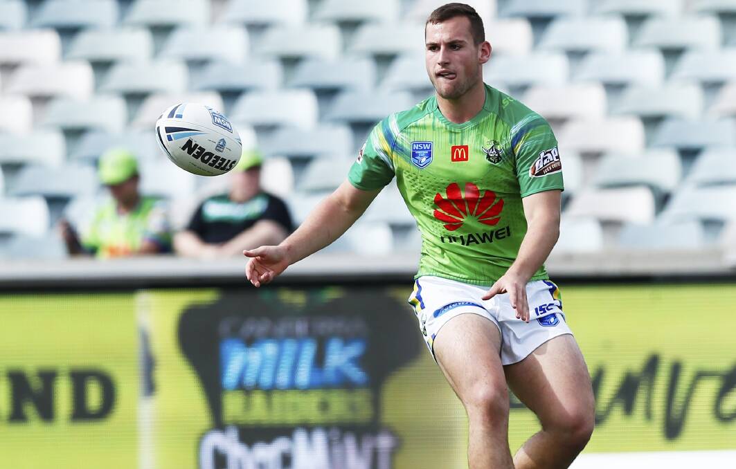 LOCK IT DOWN: Parkes' Darby Medlyn dishes off in Canberra's run to the Jersey Flegg Cup grand final. Photo: NRL PHOTOS