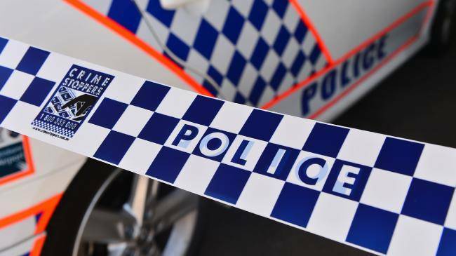 CHARGED: A man was escorted by Orana Mid-Western detectives to Tweed Heads Police Station and charged with murder.