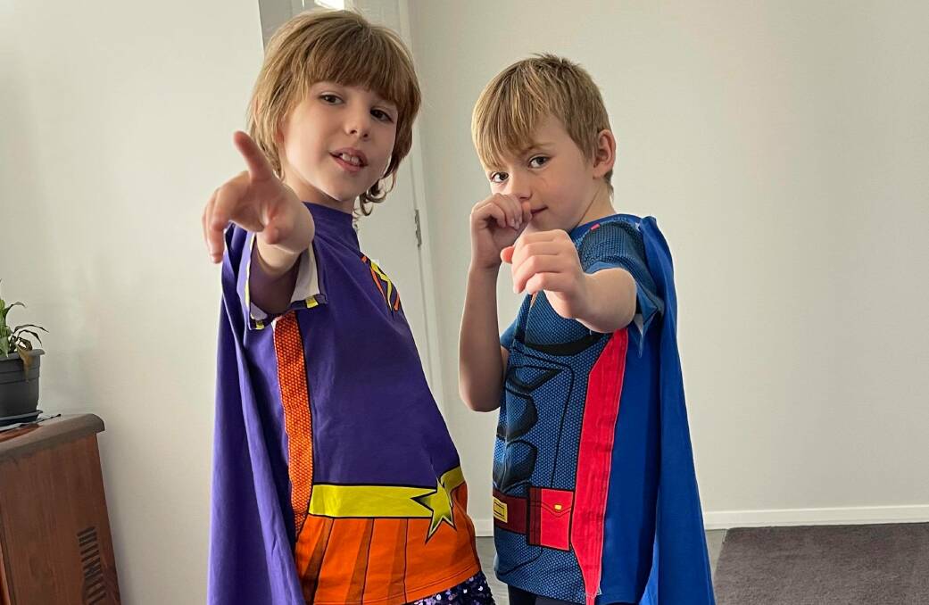 CAPED CRUSADERS: Connie and Ben Roxburgh show off their Supertees, which have helped them fight an undiagnosed bowel condition. Photo: CONTRIBUTED