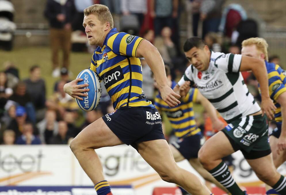 HEADING WEST: Sydney University five-eighth Stu Dunbar finds space in last year's grand final win over Warringah, he's expected to wear No.10 at Mudgee. Photo: KAREN WATSON