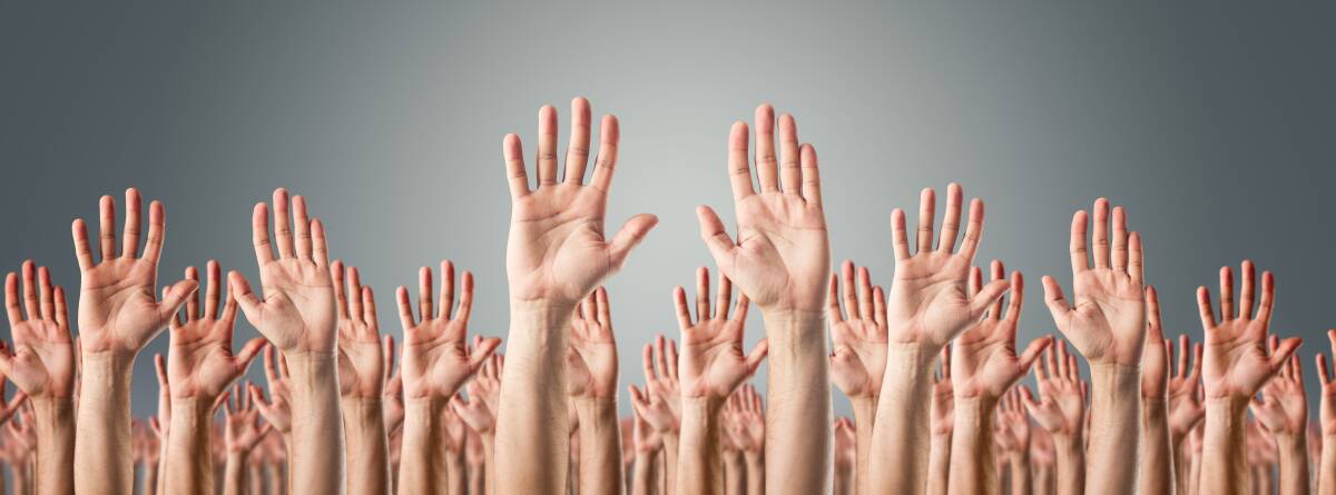 Many hands: Put your hand up to help out in your community, because every little bit helps and working together as a community achieves so much more. Photo: Shutterstock
