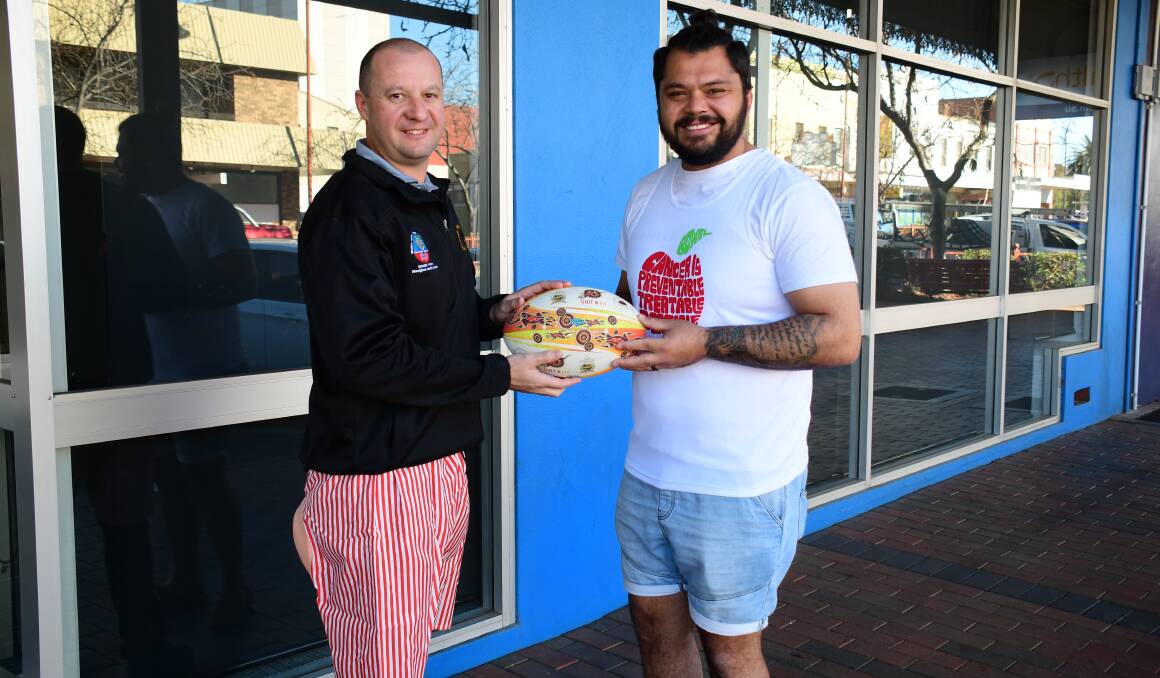 Health: Jay Forrester from WACHS wearing the Bowel Cancer Awareness 'bum shorts' that the football trainers will be donning this weekend's game and Justin Toomey-White wearing the singlet. Photo: Belinda Soole. 