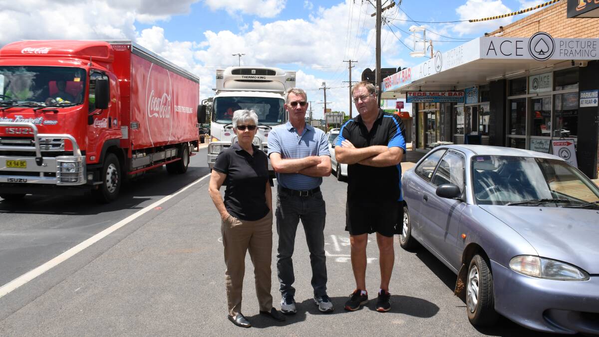 NOT HAPPY: Kath Skinner, Terry Skinner and Greg Freeman say an RMS plan to take shopfront parking away will destroy their businesses. Photo: BELINDA SOOLE. 
