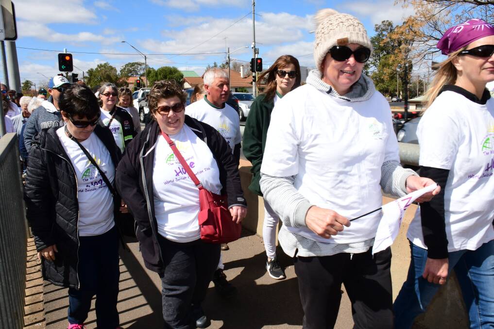 About 200 community members walked to honour the memories of their loved ones and raise suicide awareness.