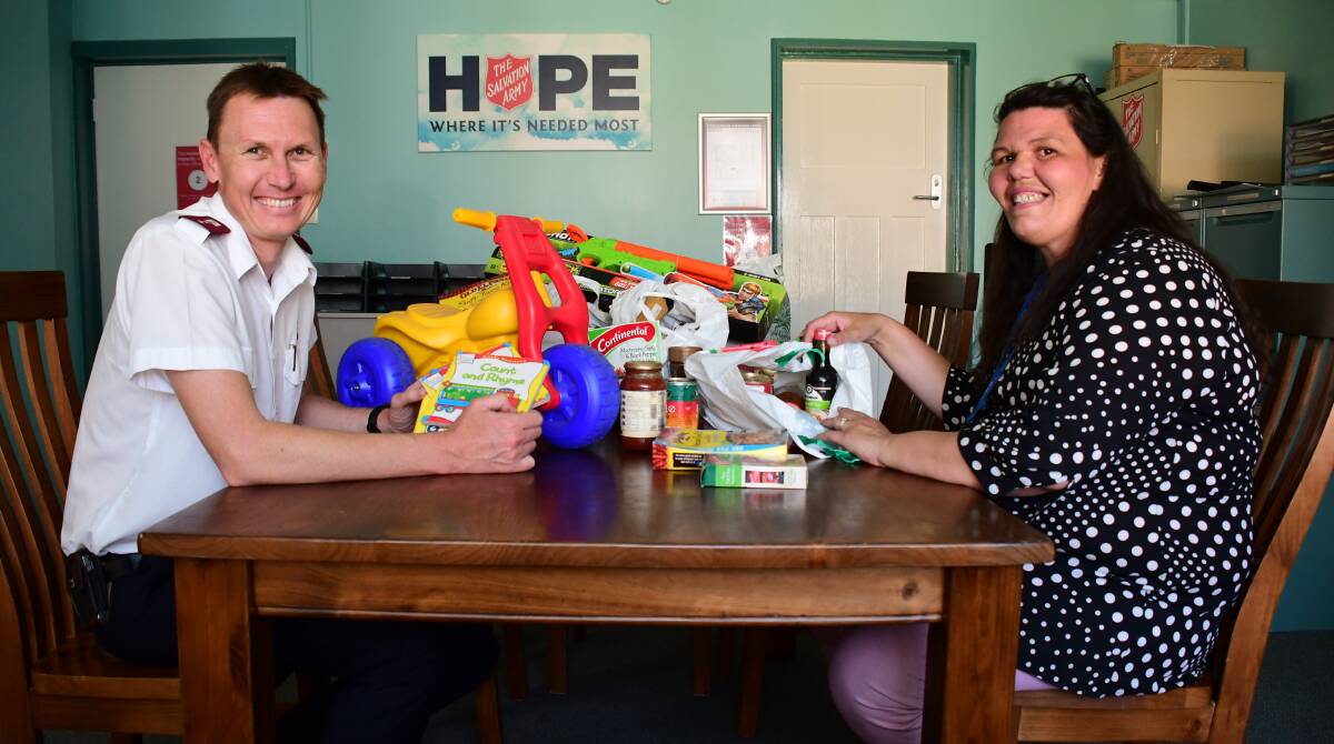 CHRISTMAS CARE: Dubbo Salvation Army Captain David Sutcliffe and Communities of Hope Facilitator Kellie Williams. Photo: BELINDA SOOLE. 