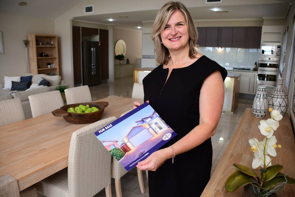 SOLD: Bob Berry Real Estate sales consultant Karen Chant inside the West Dubbo strata unit that has been bought by a "local professional' for a record price. Photo: BELINDA SOOLE
