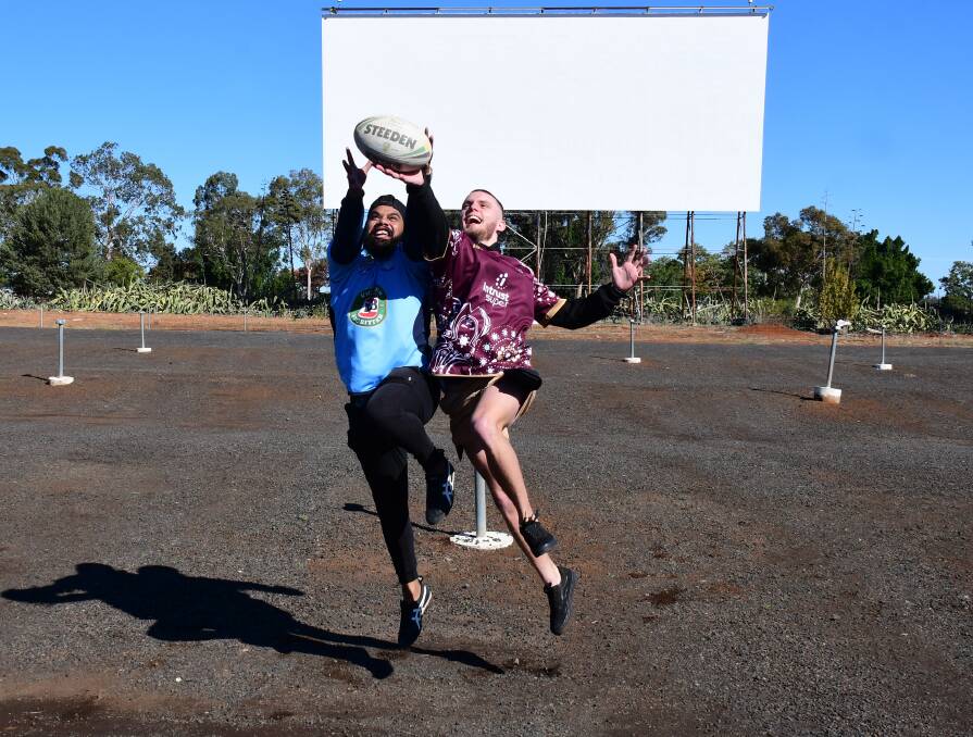 Contest: Blues fan Alex Boney and Maroons fan Myles Ryan are keen to watch the State of Origin at the drive-in. Photo: BELINDA SOOLE