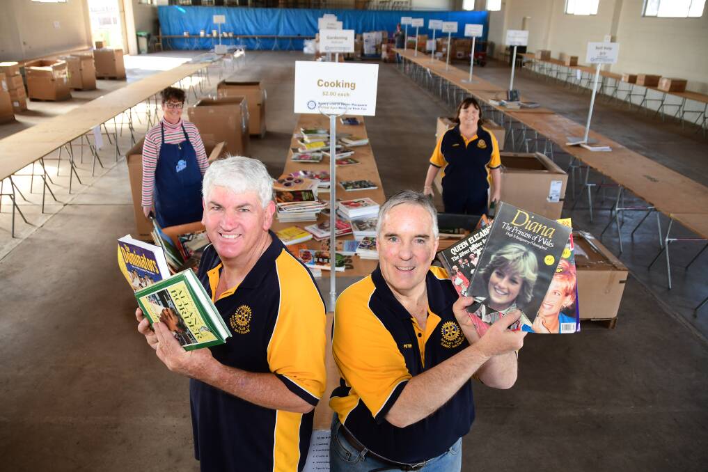 SETTING UP: Jennylee Millgate, Peter English, Peter Bartley and Lorraine Croft begin to set up the Michael Egan Memorial Book Fair that will open at 8am Saturday. Photo: BELINDA SOOLE