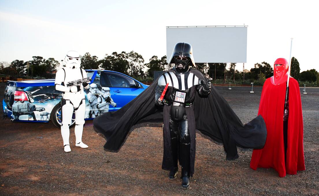 Rule the galaxy: Star Wars villain Darth Vader, flanked by a storm trooper and an imperial guard, at Dubbo's drive-in. Photo: BELINDA SOOLE
