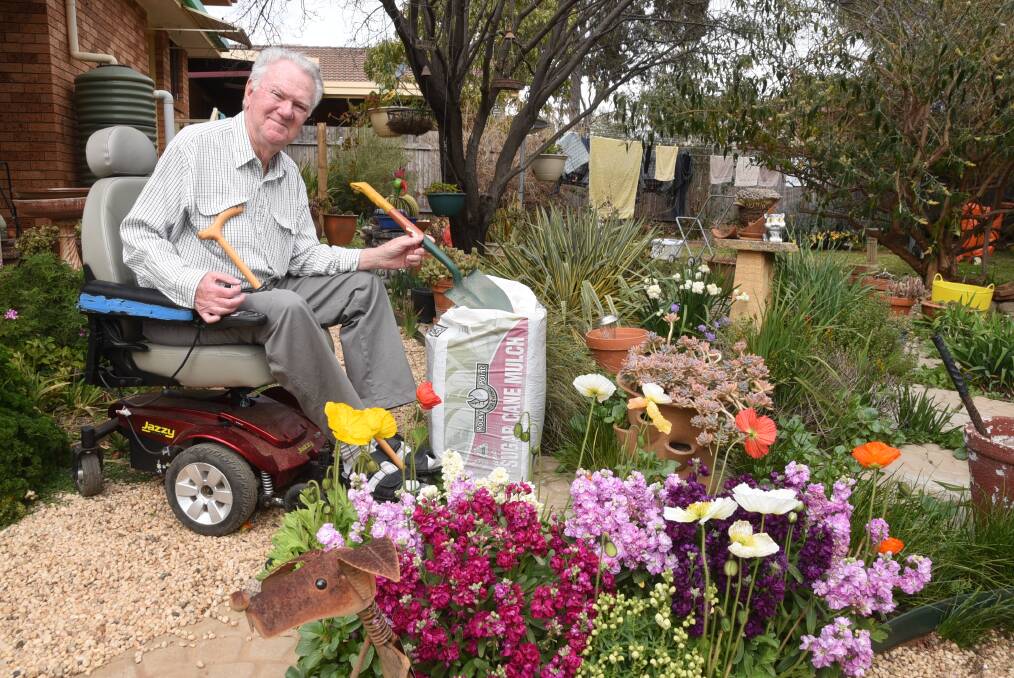 WHERE THERE'S A WILL: Ken Collins, tending his garden, has left a gift in his will for Multiple Sclerosis Limited. Photo: BELINDA SOOLE