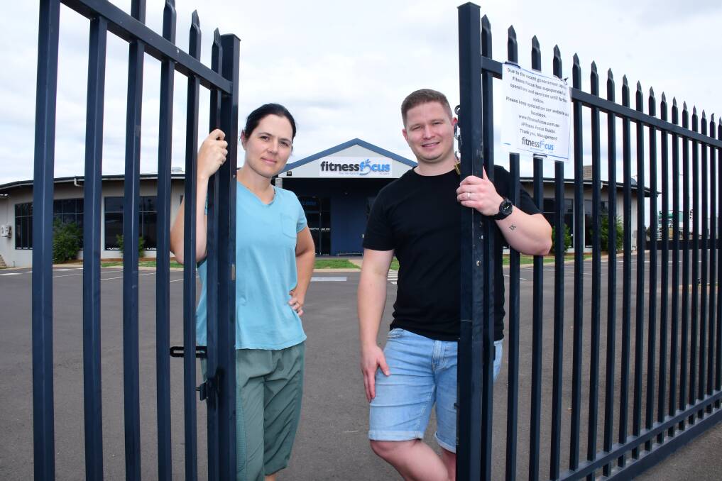 GATES LOCKED: Fitness Focus manger Cris Clark and owner Andrew Bassett after the governments forced suspension of gyms. Photo: BELINDA SOOLE