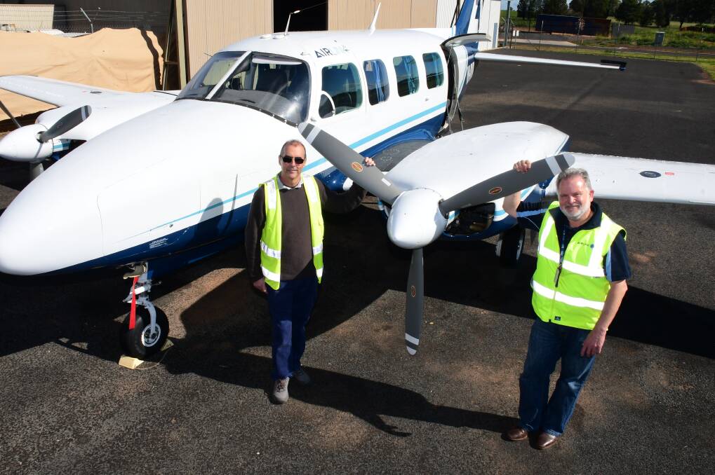 Proactive: Pat O'Shea, recruited by Air Link to be its full-time continuing airworthiness manager, at his new Dubbo workplace with Air Link general manager Ron O'Brien. Photo: BELINDA SOOLE