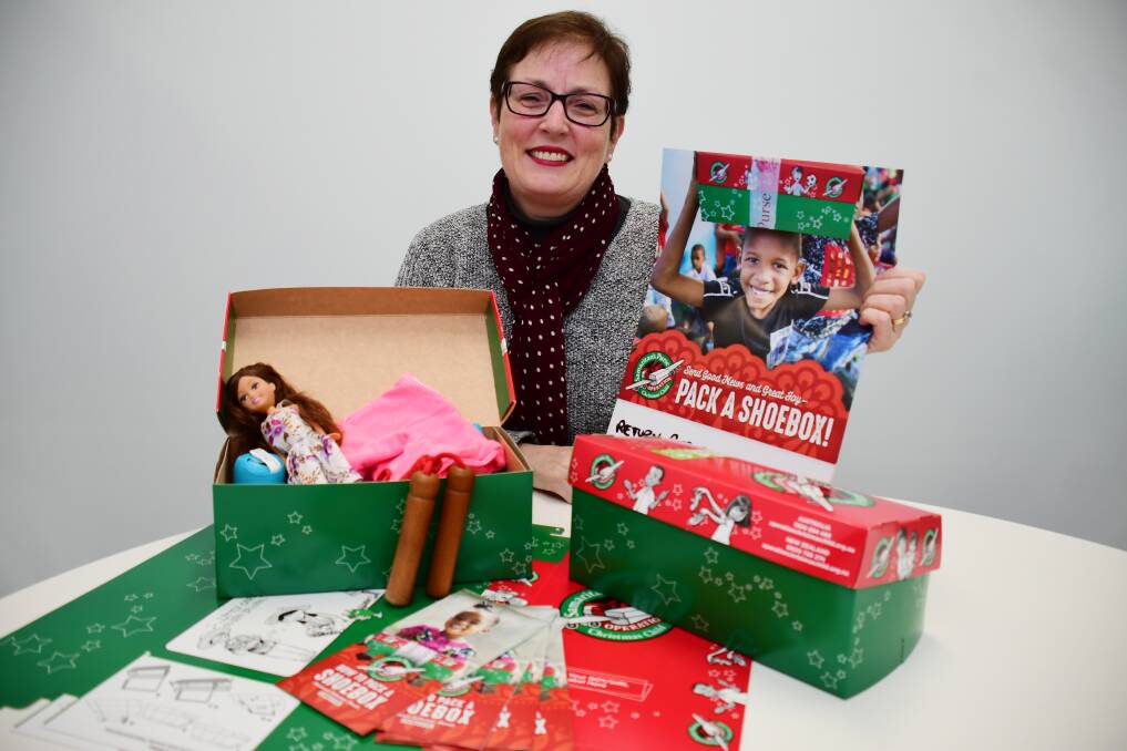 SPREADING CHRISTMAS CHEER: Sylvia Paice said it was easy to fill the Operation Christmas Child shoeboxes by grabbing a few extra things at the supermarket. Photo: BELINDA SOOLE