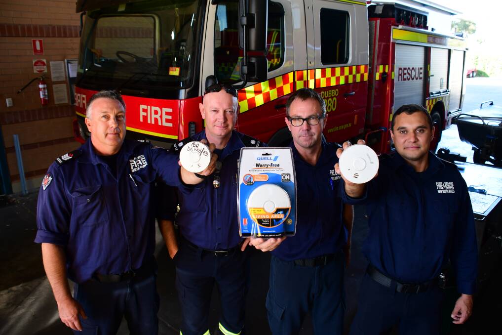 SAFETY WARNING: Dubbo firefighters Paul McLeod, Steve Gilbert, Chris Cusack and Alex Frail are reminding residents to check their smoke alarms and replace the batteries if needed. Photo: BELINDA SOOLE
