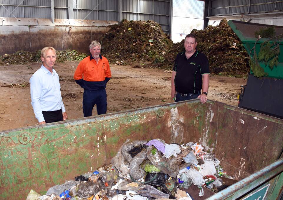 RUBBISH: Dubbo Regional Council manager solid waste Mark Giebel, Ken Matheson and JR Richards regional manager Shane Fuller with the contamination. Photo: BELINDA SOOLE