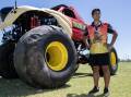 Cassius Stevenson standing in front of the 'Tassie Devil' monster truck. Picture by Belinda Soole 