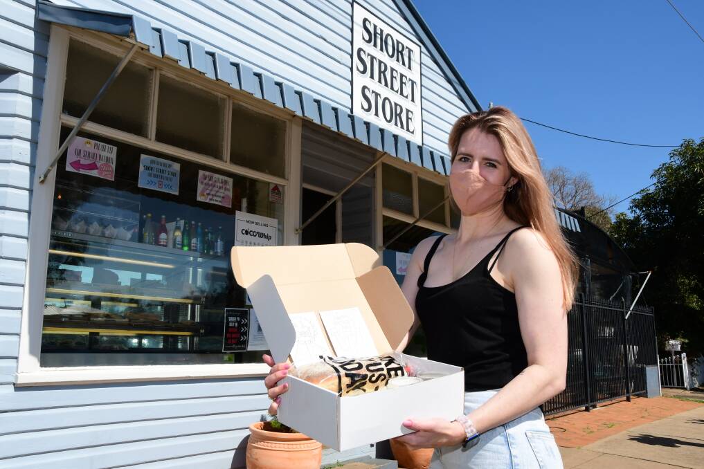 THINKING OUTSIDE THE BOX: Short Street Store owner Krysten Hedger with a Father's Day specialty pack. Photo: BELINDA SOOLE