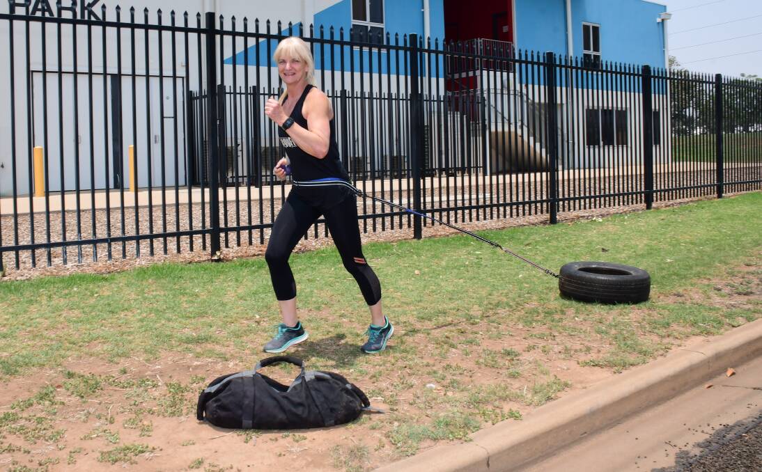 Endurance: Mel Currey with the heavy training gear she uses to prepare for endurance athletics. Photo: Belinda Soole. 