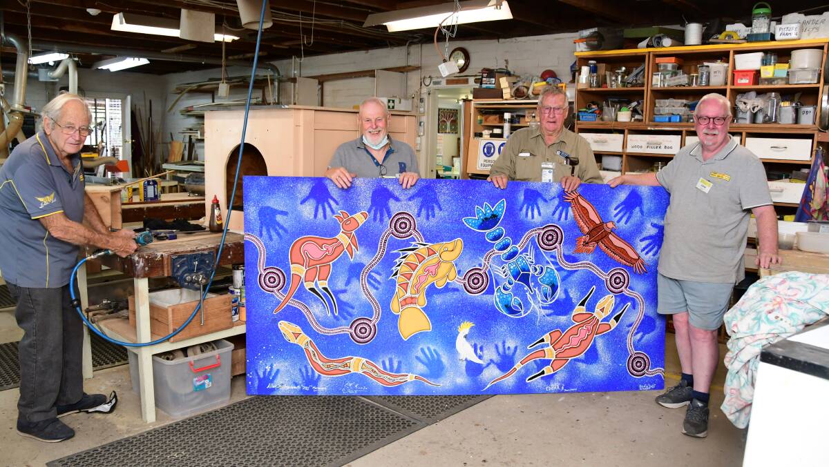 BACK IN THE SHED: Ernie Coffee, Bill Critchley, Kevin Sinclair and John Gibson work on the framing of the artwork for PCYC Dubbo. Photo: BELINDA SOOLE.