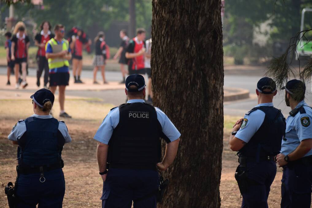 POLICE PRESENCE: Dubbo police keep an eye on students and staff after the school was placed into lockdown. Photo: BELINDA SOOLE