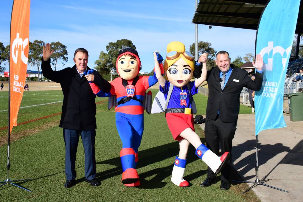 Big game: Newcastle Jets CEO Lawrie McKinna and our mayor Ben Shields, with a couple of friends, jump for joy over the Jets' pending game in Dubbo. PHOTO: BELINDA SOOLE.