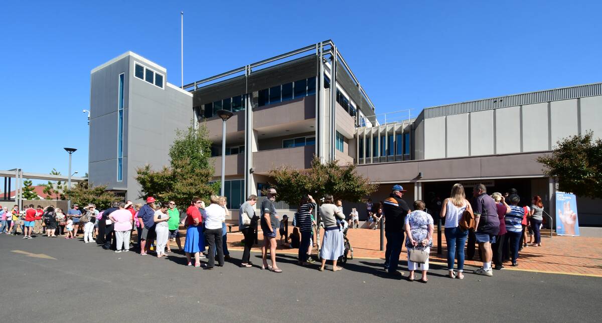 WAITING: Dubbo residents queue for free flu vaccinations at a one-off clinic at Dubbo Regional Council's Civic Administration Building on Friday. Photo: BELINDA SOOLE