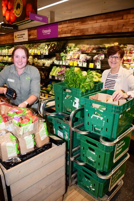 Extra demand: Woolworths personal shopper Holly Fish prepares an online order with Riverdale store manager Gai Hicks. Photo: BELINDA SOOLE