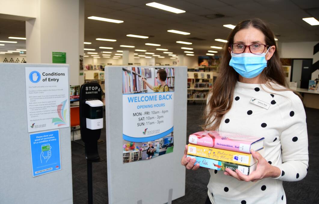 GETTING READY: Melissa Tong helps get Dubbo branch of Macquarie Regional Library ready for reopening later this month. Photo: BELINDA SOOLE. 
