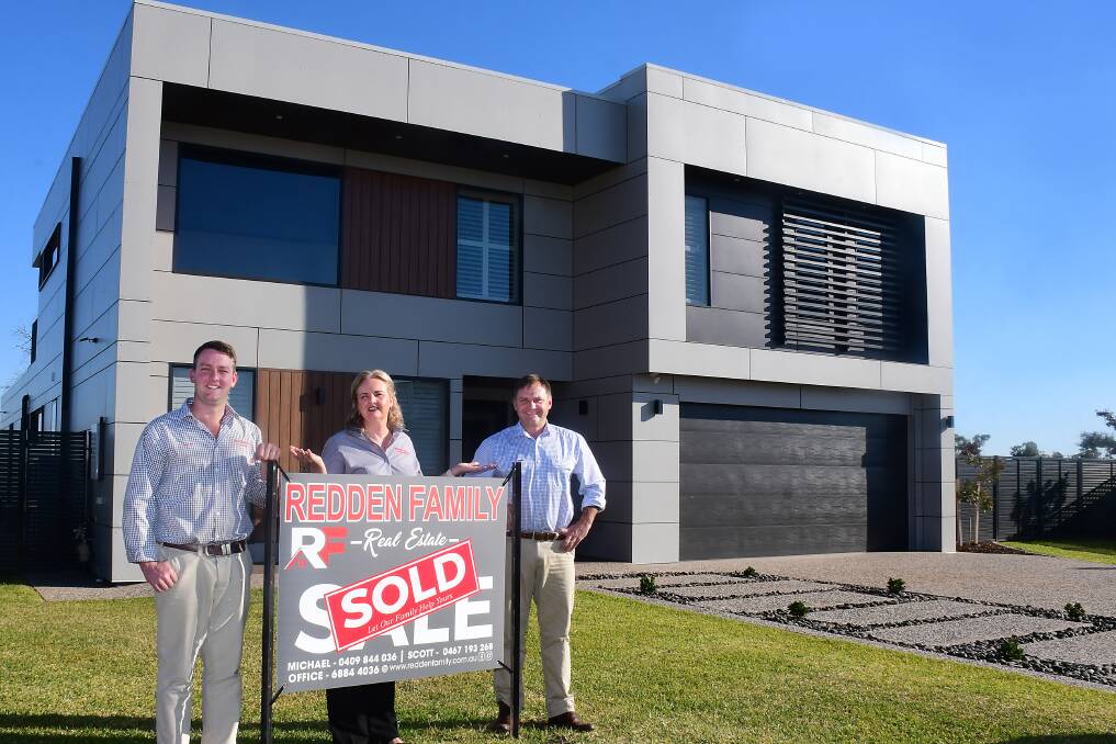 SOLD: Scott, Tracey and Michael Redden in front of Dubbo's most expensive home. Not pictured, Cindy Redden. Photo: BELINDA SOOLE
