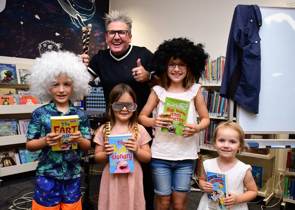 Thumbs Up: Author Andy Jones with Peregrine, Beatrix, Isla and Violet Volkofsky at the Dubbo Macquarie Regional Library for the Rap N Roll Show, which was held on Thursday. Photo: BELINDA SOOLE. 