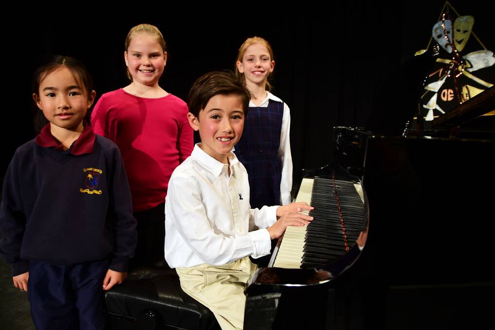 SHINING ON STAGE: The young piano players gave it their all in front of adudicator Anne Whale at the Dubbo eisteddfod on Tuesday in the nine years and under solo section. Photo: BELINDA SOOLE