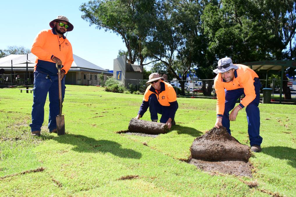 GREEN SPACE: Zaiden Britt, Mitchell Parker and Tim Shipard from Dubbo Regional Council inspecting the newly-laid turf at the park. Photo: BELINDA SOOLE