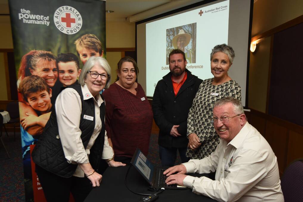 Dubbo Red Cross staff Yvonne Dodd, Maree Grant and Peter Chapman with Jody Brown Director NSW and ACT and John Pocius Regional Manager Greater Western.
