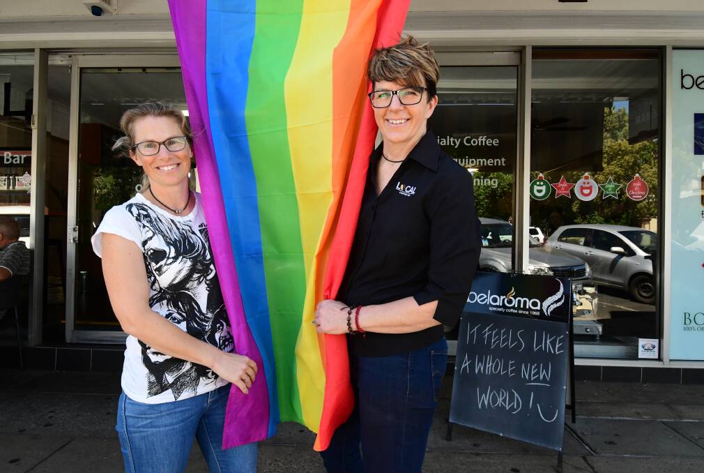 Joyful: Kym Housden and Karen Payne, who married overseas two years ago, celebrate at Dubbo after Parliament legalised same-sex marriage. Photo: BELINDA SOOLE