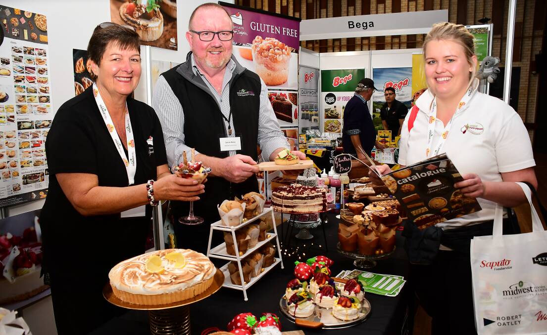Tempting: Jo-Anne Tuckett from Priestley's Gourmet Delights, Midwest Foods director Damien Mahon and Alice Cleaver from Inland Petroleum at the Central West Food and Liquor Expo. Photo: BELINDA SOOLE