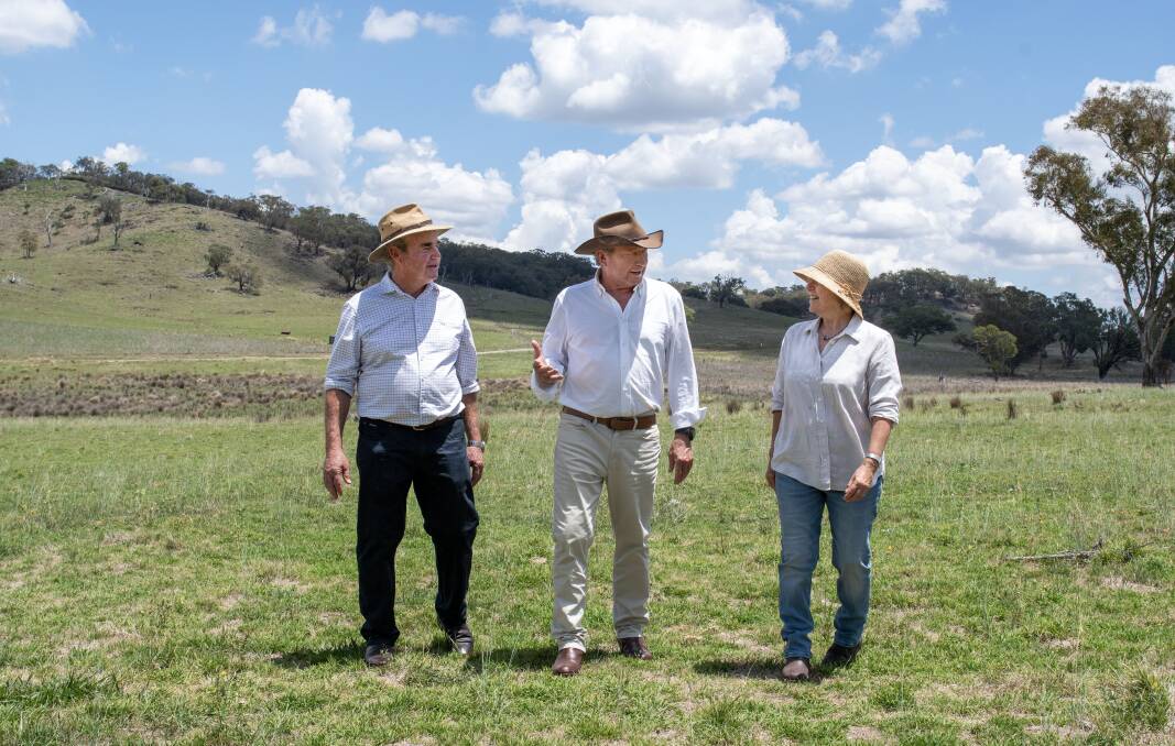 Andrew Forrest (centre) with landholders Penny and John Holland. Picture by Belinda Soole