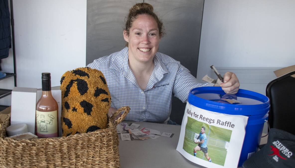 RAISING FUNDS: Kimberly Fyfe with some of the raffle and auction items. Photo : BELINDA SOOLE.