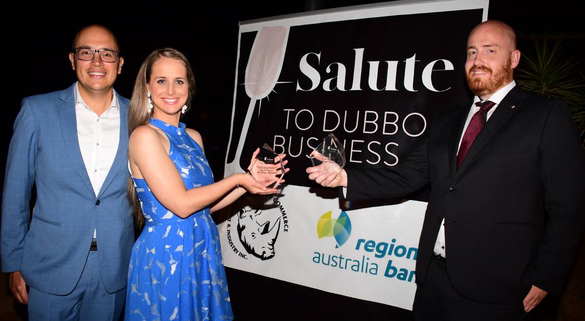 Win: Samuel and Laura Shooter from SJ Shooter Real Estate and Summit Cranes director Joshua Shields with the awards for diversification and innovation. Photo: BELINDA SOOLE