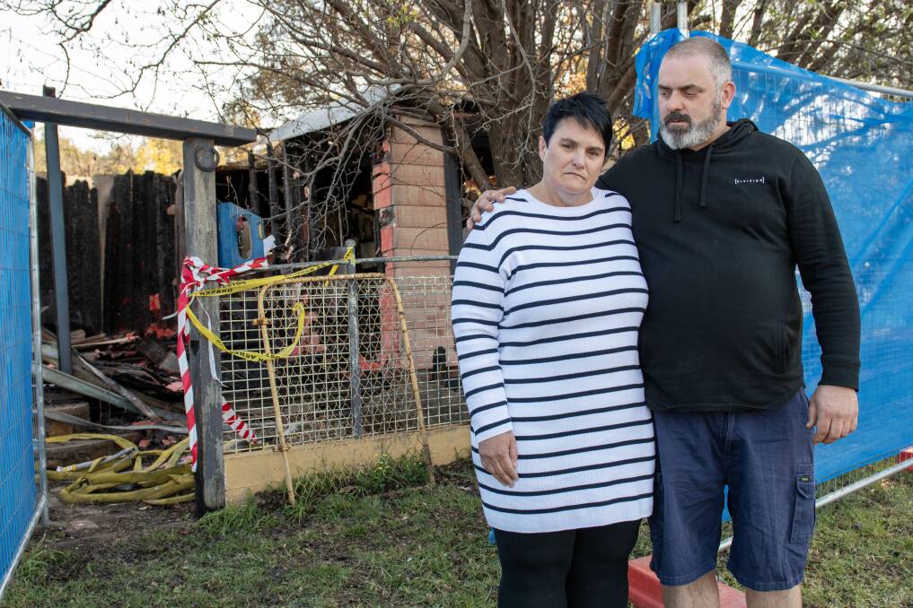 Cass and Stuart Wright in front of their destroyed home. Picture by Belinda Soole 