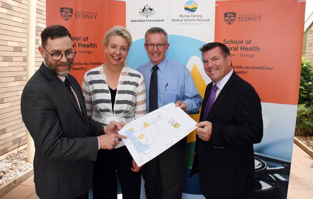 PLANS: Dr Mark Arnold, Senator Bridget McKenzie, Mark Coulton and Dugald Saunders look over the plans for the redevelopment of the School of Rural Health to accommodate a graduate medical school. Photo: BELINDA SOOLE