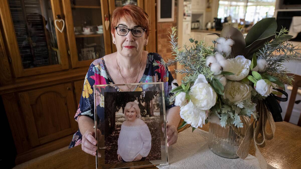 Gone too soon: Ann Beggs holds a photograph of her daughter Carrie-Ann Beggs who died from melanoma aged 43. Photo: BELINDA SOOLE