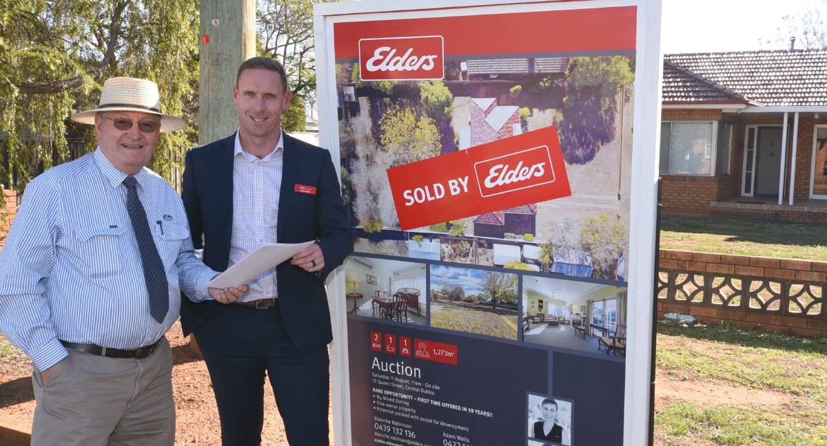 SOLD: Real estate agents Bob Berry and Adam Wells are all smiles after a record breaking rolling year of house sales in Dubbo. Photo: Belinda Soole. 