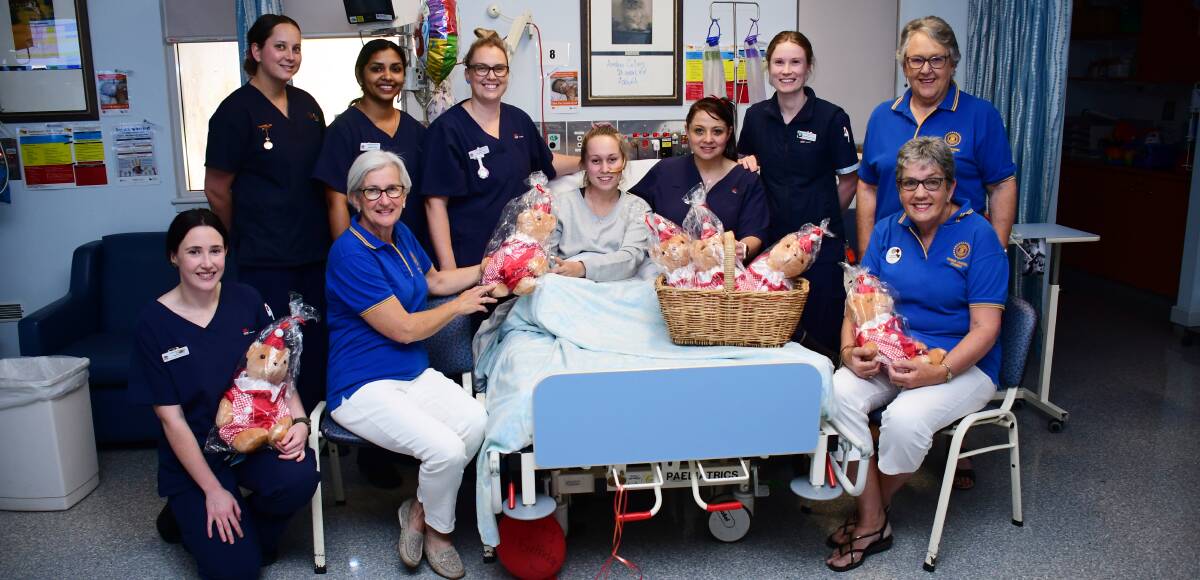 DONATION: Dubbo Hospital children's ward staff and members of Dubbo Inner Wheel show patient Amber Collins the bears. Photo: BELINDA SOOLE