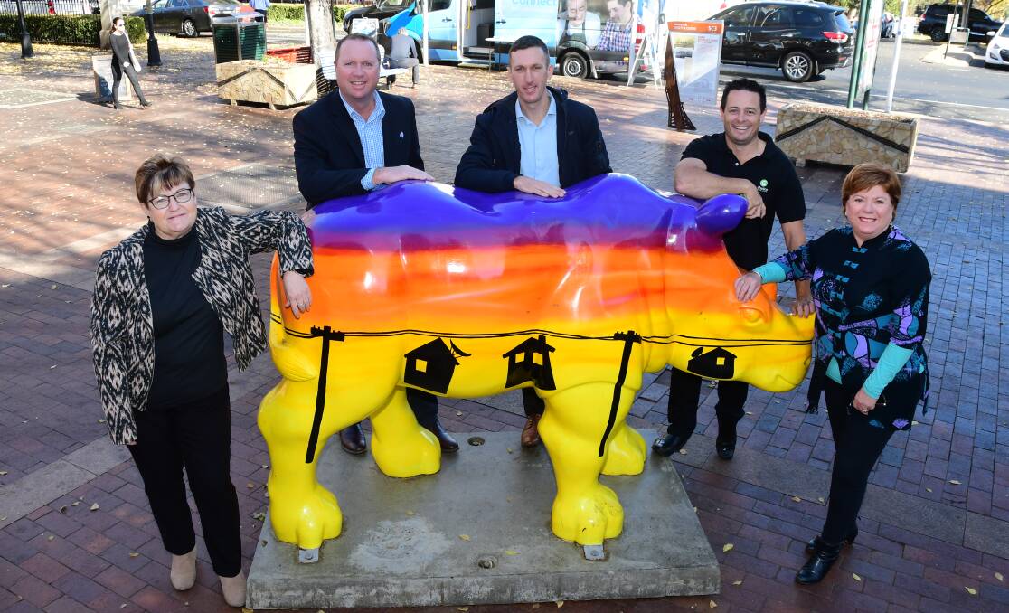 HEAT IS ON: Marilyn Brann, Regional Australia Bank's Ben Luck, Jared Weber from Anittel, Matt Wright and Toni Beatty are getting primed for the Rhinos. Photo: BELINDA SOOLE