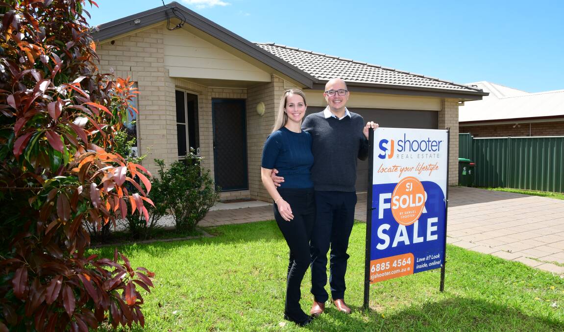 SOLD: Laura and Samuel Shooter at the investment property they sold in August. Photo: BELINDA SOOLE.